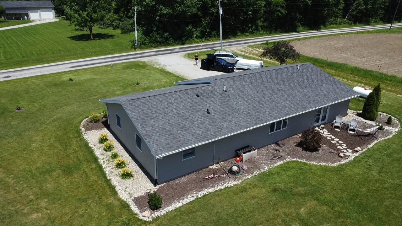 Aerial view of a ranch home with a newly installed Owens Corning Duration shingle roof by Affordable Roofing
