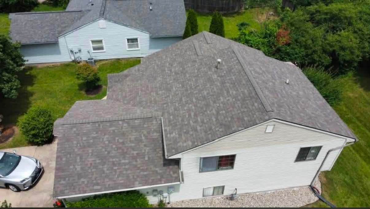Aerial view of a home with a newly installed Owens Corning Oakridge Driftwood shingle roof by Affordable Roofing