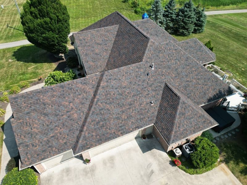 Brown architectural shingle hip roof replaced by Affordable Roofing in Fort Wayne
