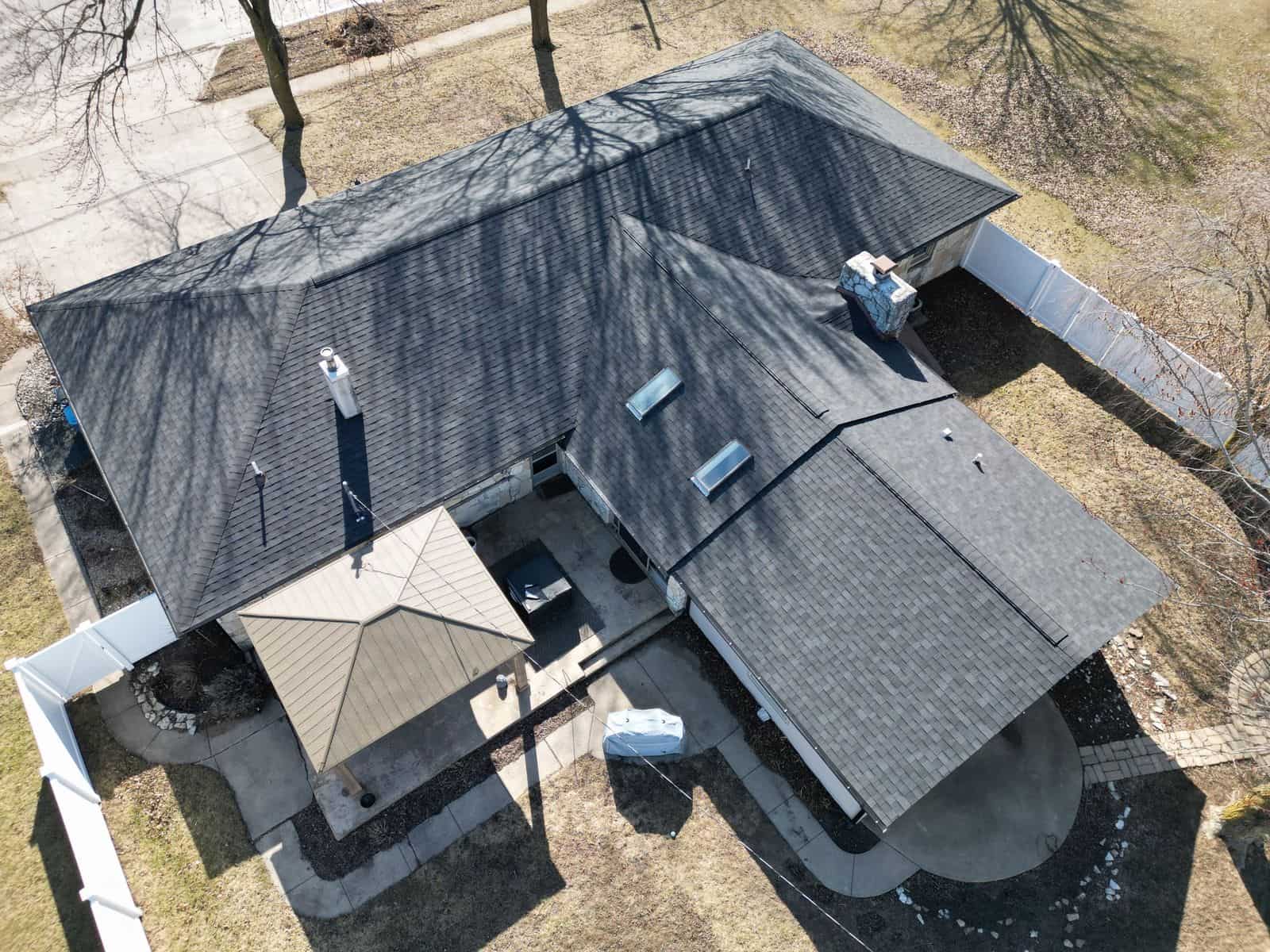 Aerial view of a dark gray architectural shingle roof replacement by Affordable Roofing in Fort Wayne